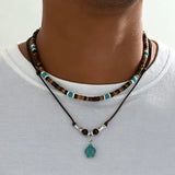 A luxurious man's necklace with turquoise and tiger's eye.