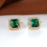 Golden earrings with green square zircons