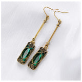 Golden earring with green pendant