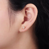 Nail earrings with delicate flowers