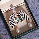 Zebra earrings with a pearl