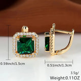 Golden earrings with green square zircons