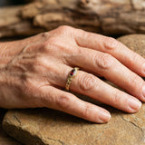 Golden vintage ring with a red crystal