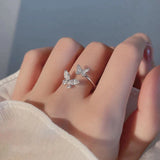 Adjustable silver ring with a sparkling butterfly