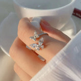 Adjustable silver ring with a sparkling butterfly