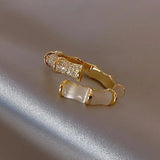 Adjustable Luxurious Ring with White Opal in Gold