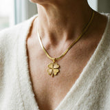 Golden Necklace with a Clover Pendant