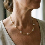 Golden necklace with a freshwater pearl
