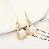 Golden pearl earring
