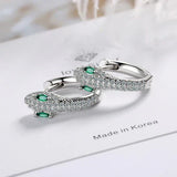 Silver earrings designed as a snake