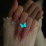 Bracelet and necklace set with a blue luminous butterfly