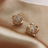 Golden earrings with zirconia spheres