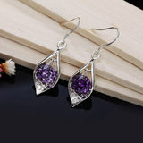 Silver earrings with purple crystal