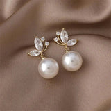 Exotic earrings with pearls and golden crystals