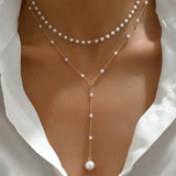 Two-strand pearl necklace with pendants