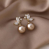 Exotic earrings with pearls and golden crystals