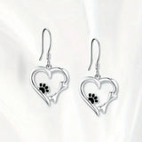 Silver earrings with heart and paw print design