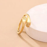Adjustable ring resembling an embrace