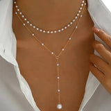Two-strand pearl necklace with pendants