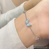 Bracelet and necklace set with a blue luminous butterfly