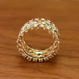 Ring with gold band braided with crystals