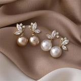 Exotic earrings with pearls and golden crystals