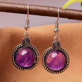 Vintage earrings with purple crystal