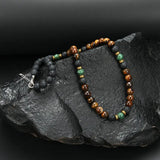 Luxury necklace with tiger eye beads and a gold clasp
