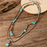 A luxurious man's necklace with turquoise and tiger's eye.