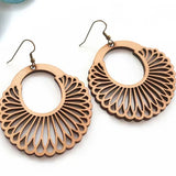 Handmade wooden earrings with a mandala