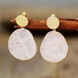 Vintage earrings with white round stone