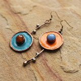 Asymmetrical vintage earrings in antique bronze with graphite