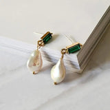 Golden earrings with pearls and emeralds