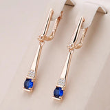 Golden earring with blue crystal
