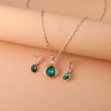 Necklace and earrings set in green crystal and gold
