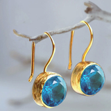 Vintage golden earring with blue crystals