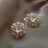 Flower-shaped earrings with elegant pearls