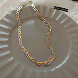 Elegant necklace in gold and silver tones