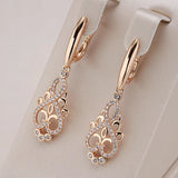 Elegant earring with zircon in golden color