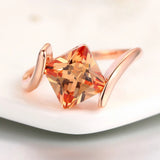 Rose gold pyramid cut orange gemstone ring