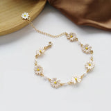 Vintage bracelet with beads, gold and white flowers