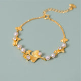 Classic golden bracelet with ginkgo leaves and pearls