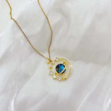Necklace with planet, star and golden star pendant