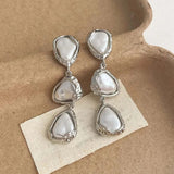 Silver triangular earrings with pearls