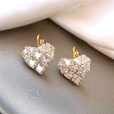 Golden heart-shaped earring with diamond