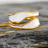 Open ring, white and gold enamel spiral design