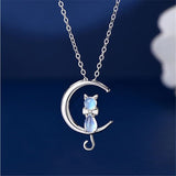A Companion necklace, the pendant is a half moon and cat-shaped moon stone