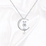 A Companion necklace, the pendant is a half moon and cat-shaped moon stone